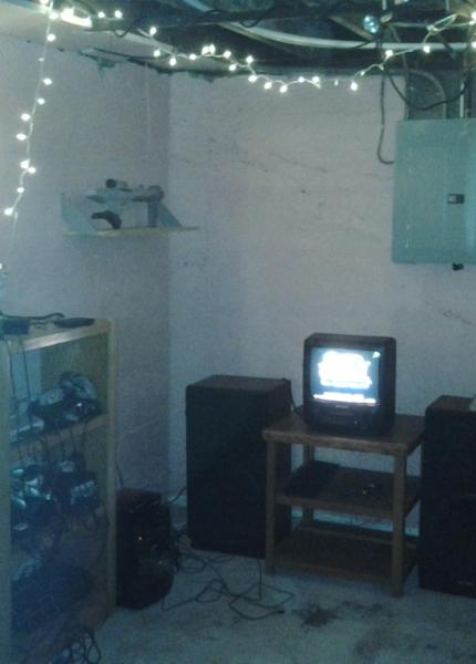 A small CRT TV and a variety of retro consoles.